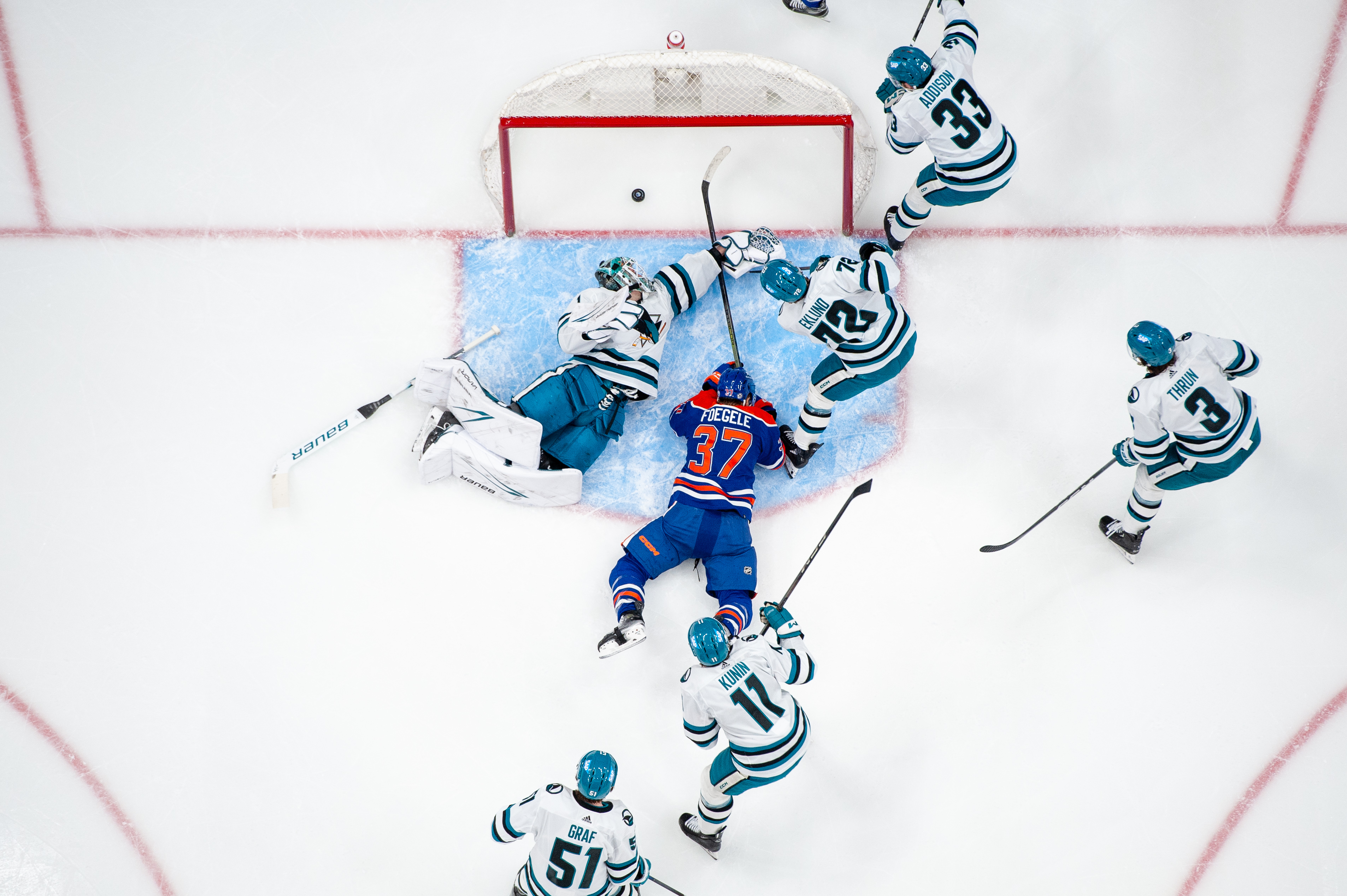 Warren Foegele, forward for the Edmonton Oilers, scores against the San Jose Sharks in a 9-2 victory at Rogers Place in Edmonton, Alberta, Canada