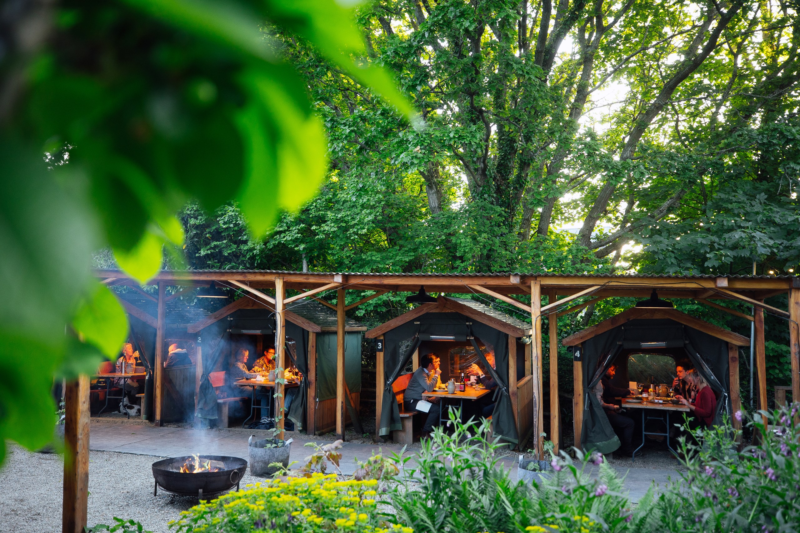 Dining huts in the Secret Garden are perfect for summer soirées