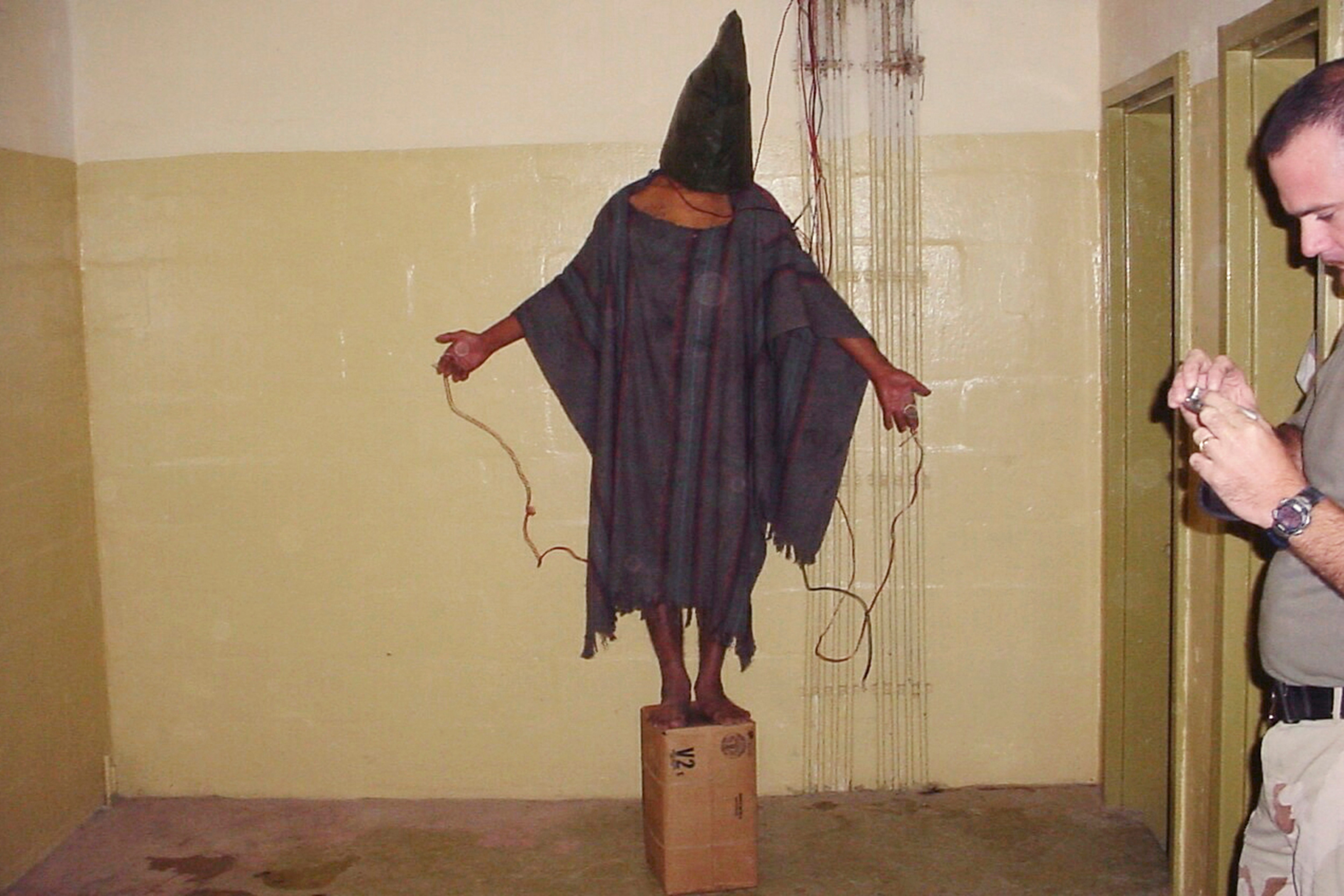 This image of an abused prisoner was obtained by the Associated Press and became emblematic of the scandal of Abu Ghraib