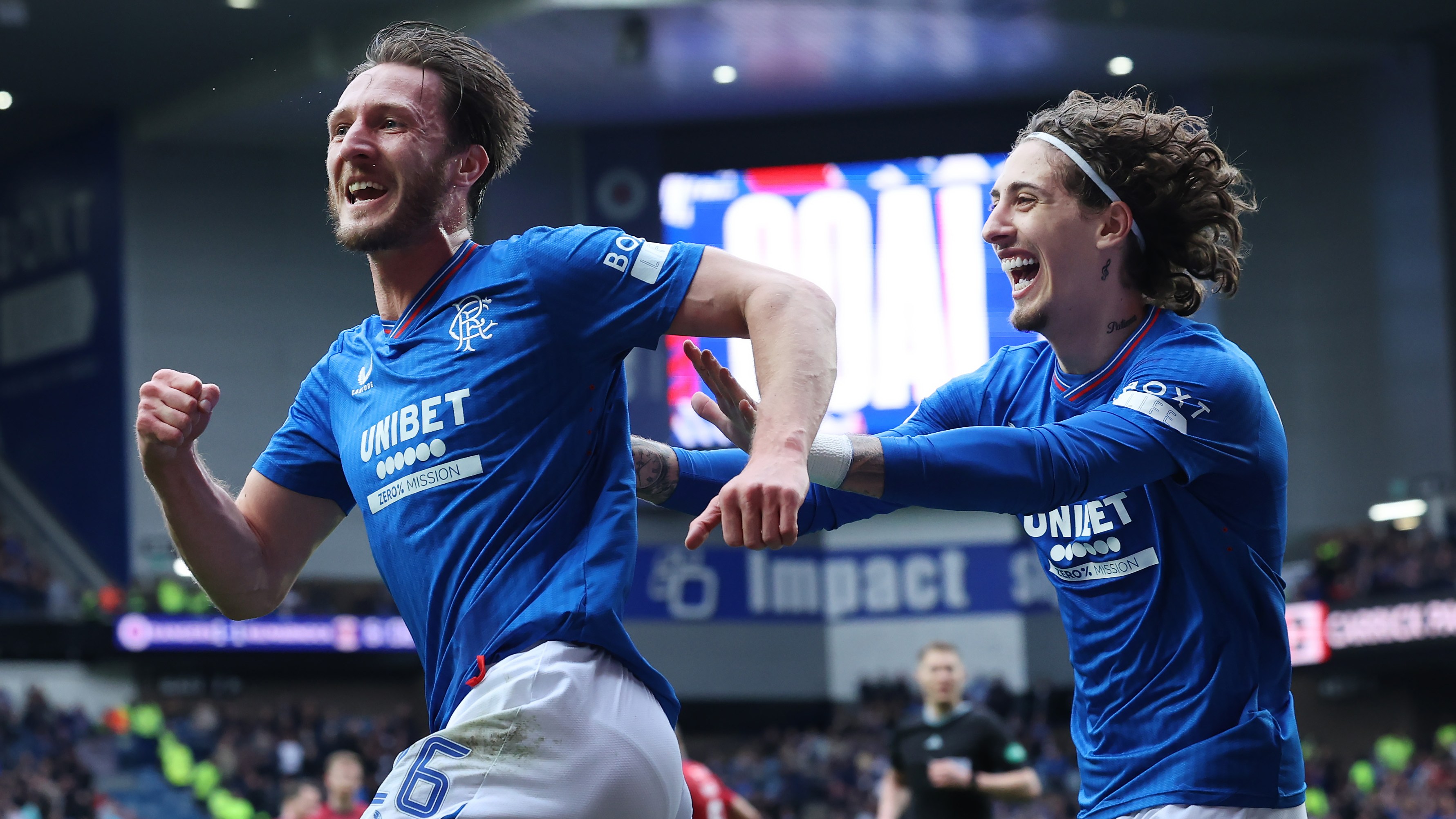 Davies celebrates with Silva after scoring Rangers’ second goal to give his side the lead