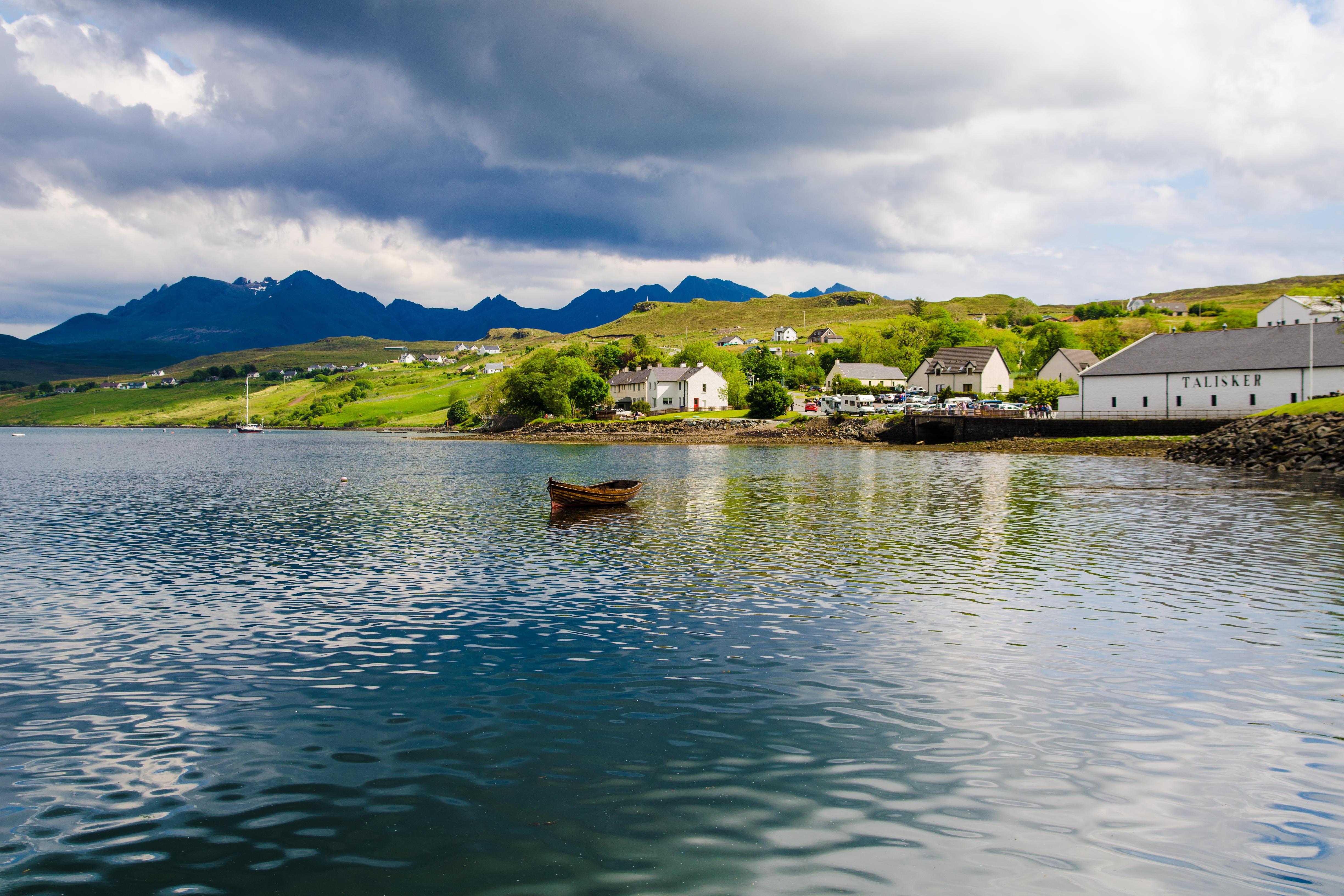 Talisker distillery and the Black Cuillin Mountains, Isle of Skye