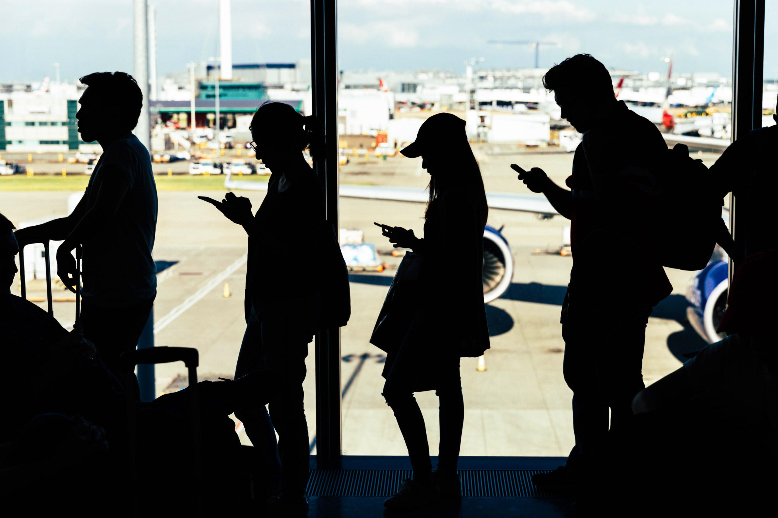Passengers wait to board at Heathrow