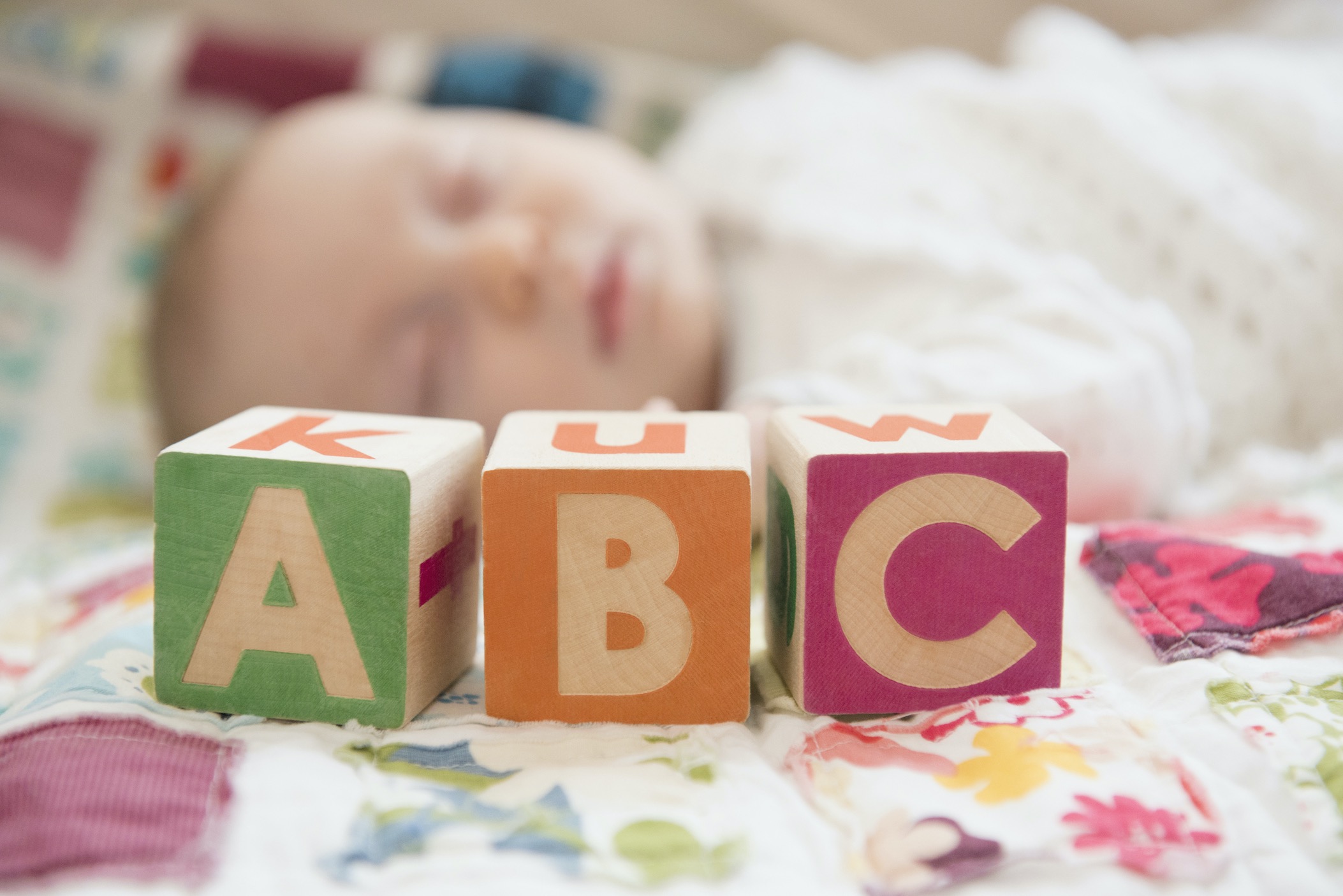 Baby with letter blocks