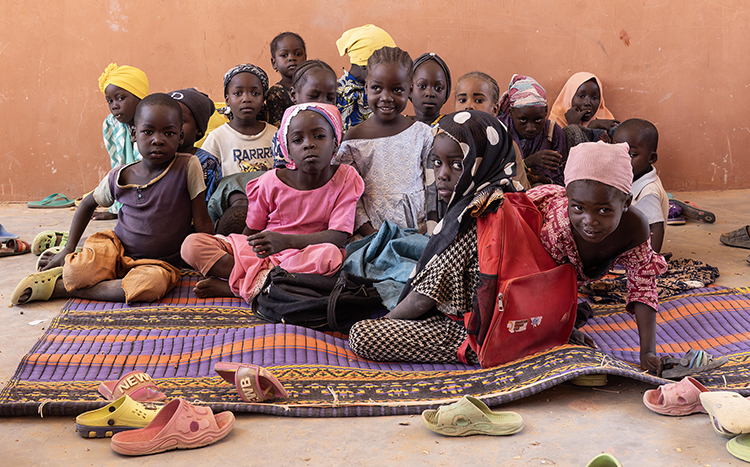 Children sitting in their classroom in Kwombo-On