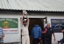 Mike Mead holds aloft the Trophy