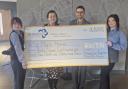 The Holiday Inn team presenting the cheque last week