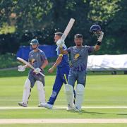 Rongsen Jonathan raises his bat after scoring a century (Match report and photographs by Richard Edmondson)