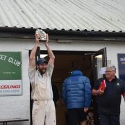 Mike Mead holds aloft the Trophy