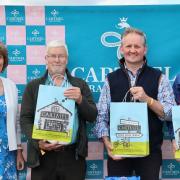 A winning team in Cartmel Races receiving sticky toffee pudding