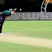 Cumbria captain Michael Slack bowling