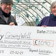 Aidan Monks of Lovingly Artisan Bakery and Growing Well manager Sinead McCann with the cheque