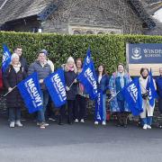 The teachers on strike outside Windermere School