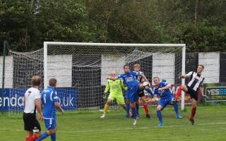 Nathan Cloudsdale, right, in goalmouth action against Droylsden