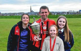 Gareth Jones with his three girls after the game