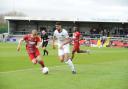 Raphael Araoye on the ball in his last game for Weston against Aveley