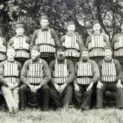 Weston's first lifeboat crew of 1882 wearing boots, woollen pullovers, cork lifejackets, and beanie hats.