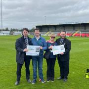 Alex Crowther, board member of Weston-super-Mare AFC (far left) had discussions with Josh Bell, co-leading partner of Donate for Defib WsM (centre left) and Christina Chell, the charity's education and awareness lead (centre right)