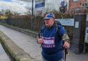 Ian Williams enjoys a glass of fizz after finishing his walk in aid of Cancer Research,