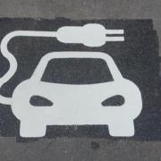 Electric vehicle charger space, painted on road