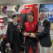 Rose Snell and Bob Moffit presenting George Carpetener with his man of the match award .