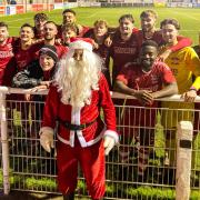 Father Christmas with the Whitchurch Alport players on Saturday.