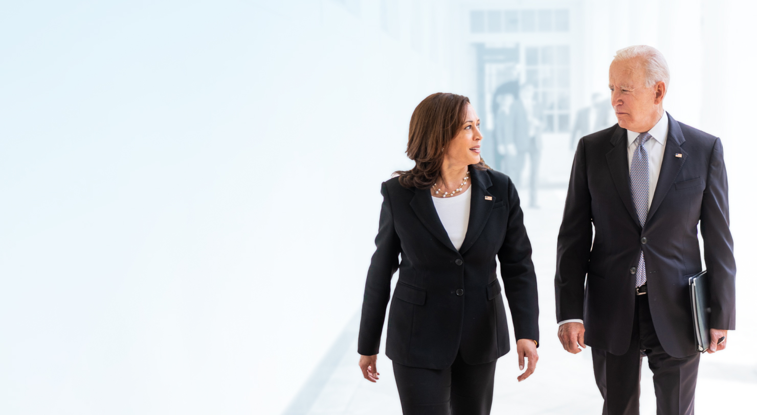 President Biden and Vice President Harris walking and talking