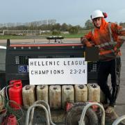 Champions: Worcester City player Kyle Belmonte returns to his day job the morning after the team won the Hellenic League.