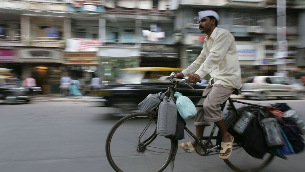 On the crowded streets of Mumbai, trains and bicycles are quicker than cars and motorbikes (Credit: Getty Images)