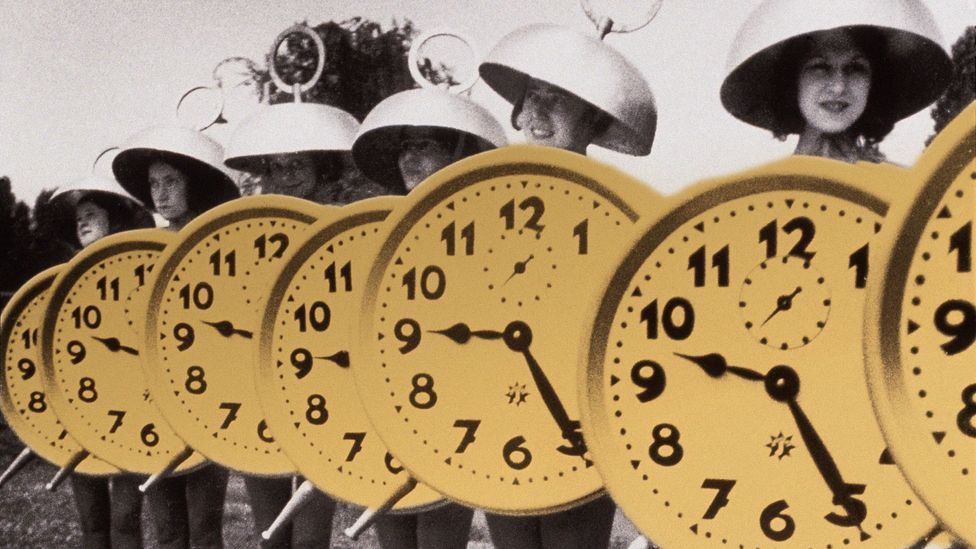 Line of women dressed as clocks (Credit: Javier Hirschfeld/Getty Images)