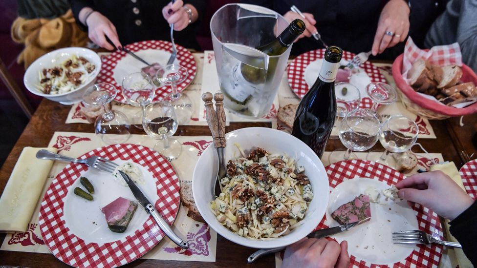 Lyon's meat-heavy mâchon includes offal-based dishes washed down with Beaujolais wine (Credit: Philippe Desmazes/Getty Images)