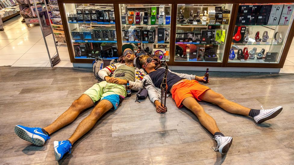 Men passed out in front of a store
