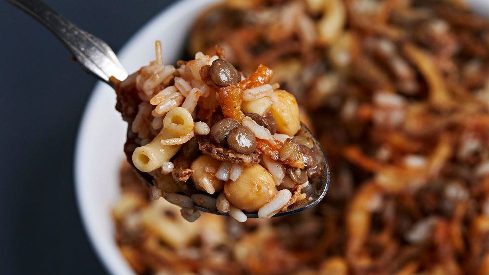 Spoonful of stew made with lentils, rice and pasta (Credit: Getty Images)